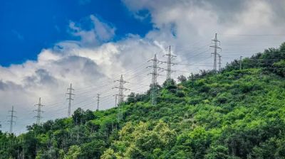 depositphotos_830047514-stock-photo-power-lines-green-hill-dense