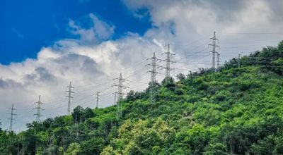 depositphotos_830047514-stock-photo-power-lines-green-hill-dense